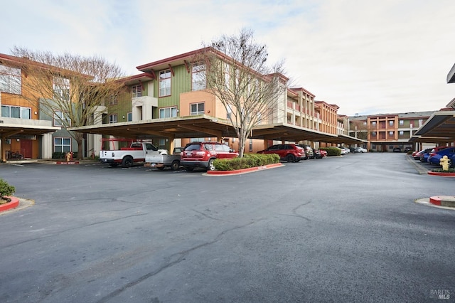 view of building exterior with covered parking