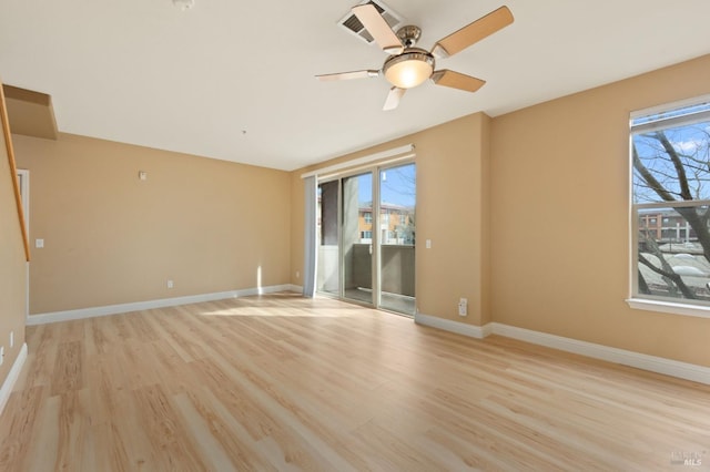 empty room with light wood-type flooring, baseboards, and a ceiling fan