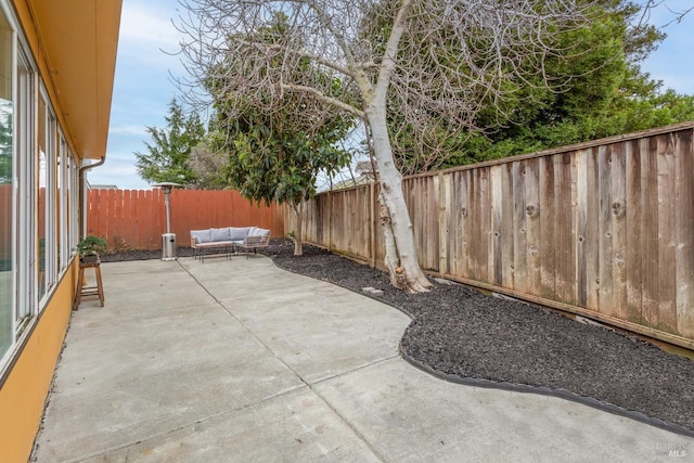 view of patio / terrace featuring a fenced backyard and an outdoor living space