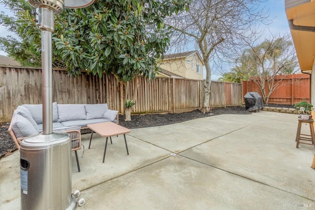 view of patio / terrace featuring an outdoor hangout area and a fenced backyard