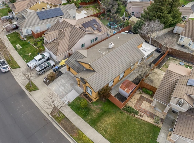 birds eye view of property with a residential view