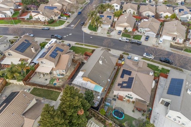 birds eye view of property with a residential view