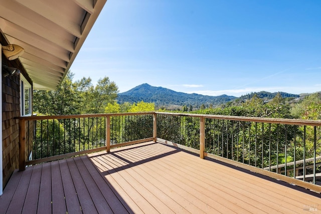 wooden deck with a mountain view