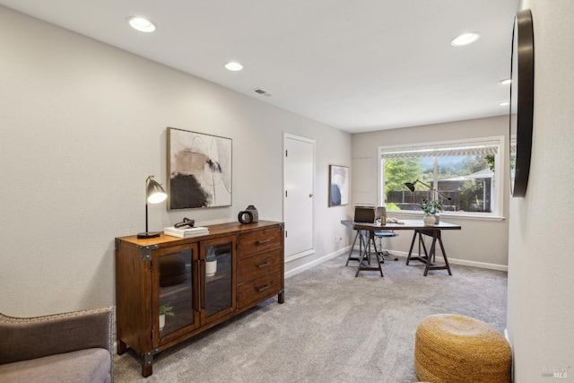 office space featuring recessed lighting, light colored carpet, visible vents, and baseboards