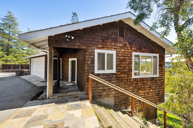 exterior space featuring driveway and a garage