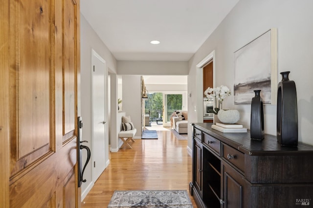 interior space with recessed lighting, light wood-style flooring, and baseboards