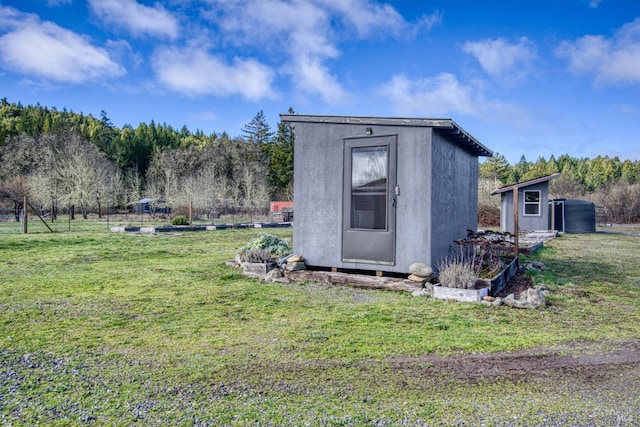 view of shed with fence