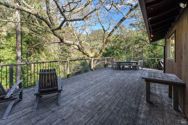 deck with outdoor dining space