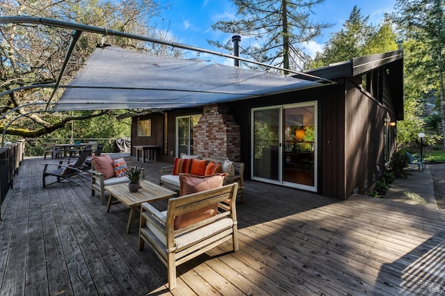 wooden terrace featuring an outdoor hangout area