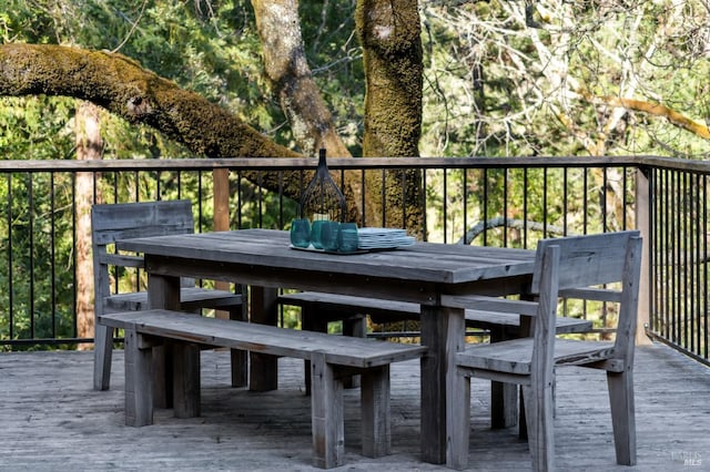 wooden deck featuring outdoor dining area