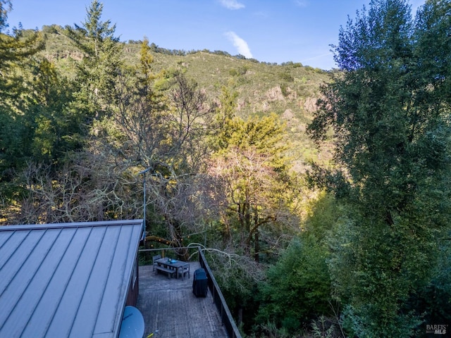 exterior space featuring a view of trees