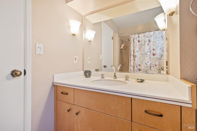 bathroom featuring vanity and a shower with curtain