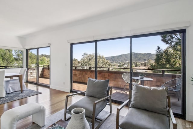 sunroom / solarium with a wealth of natural light and a mountain view