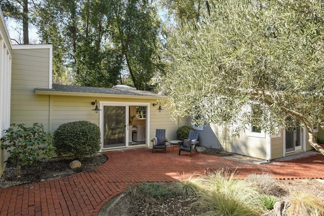 rear view of house featuring a patio