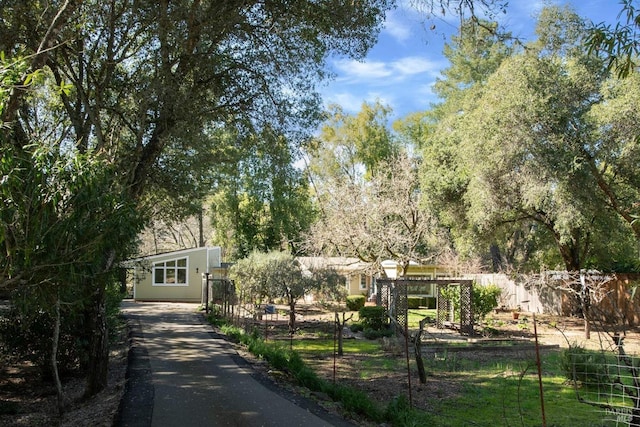 view of front of home featuring fence