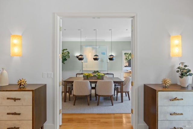 dining space featuring light wood-style floors