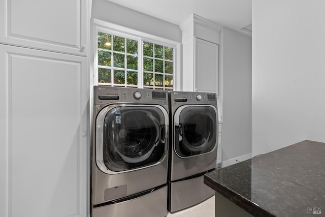 washroom featuring laundry area and washing machine and clothes dryer