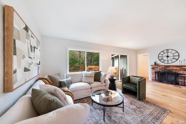 living area featuring a fireplace and wood finished floors