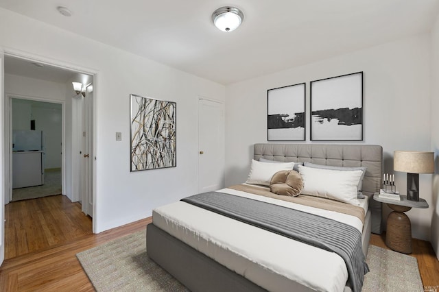 bedroom with light wood-style floors