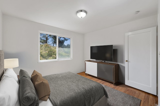 bedroom with wood finished floors