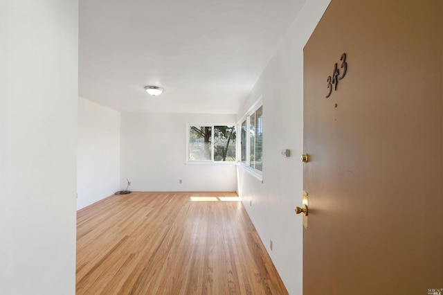 unfurnished room featuring light wood-type flooring