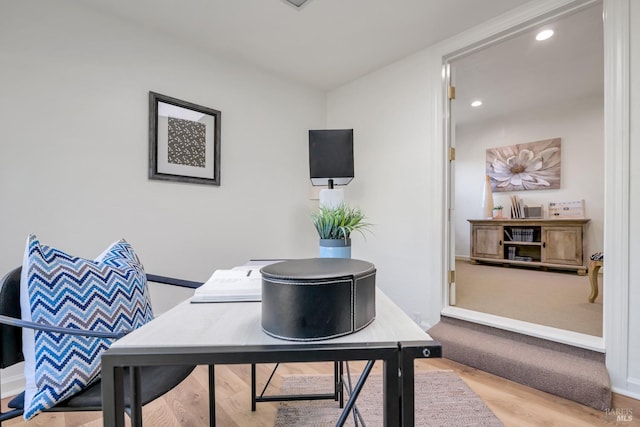 office space featuring baseboards, wood finished floors, and recessed lighting