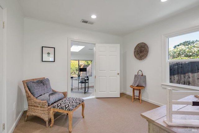 sitting room with recessed lighting, light carpet, a skylight, visible vents, and baseboards