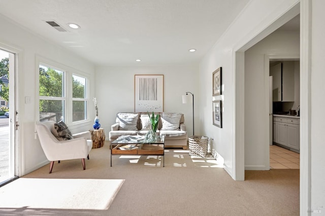 interior space with light carpet, baseboards, visible vents, and recessed lighting