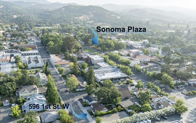 birds eye view of property with a residential view and a mountain view