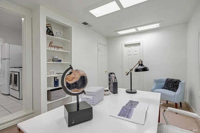 living area with built in shelves and visible vents