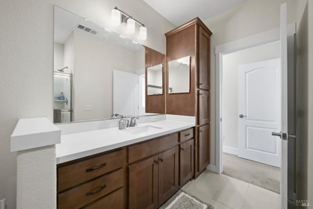 full bathroom featuring vanity, tile patterned flooring, and visible vents