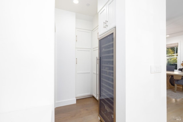 interior space with wine cooler and light wood-type flooring