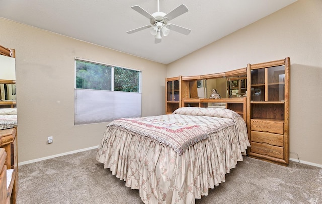 carpeted bedroom featuring lofted ceiling, ceiling fan, and baseboards