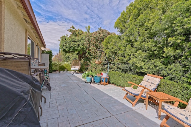 view of patio featuring a grill