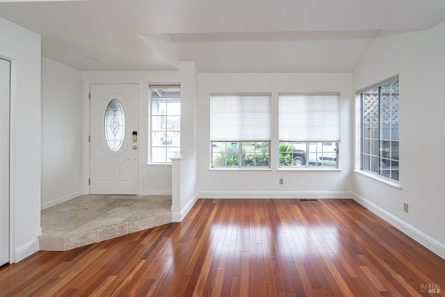 entryway featuring visible vents, baseboards, and hardwood / wood-style flooring