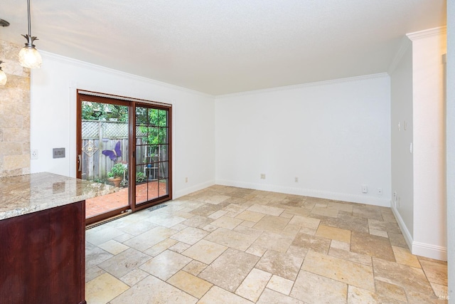 empty room with visible vents, baseboards, ornamental molding, a textured ceiling, and stone tile flooring