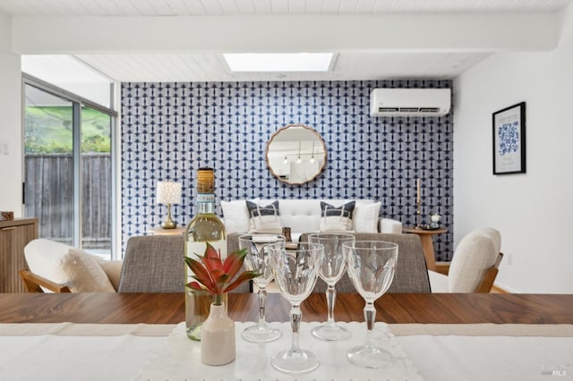 dining space featuring a skylight, wooden ceiling, an accent wall, a wall mounted air conditioner, and beam ceiling