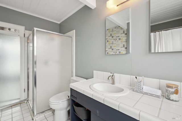 full bath with a stall shower, vanity, toilet, and tile patterned floors