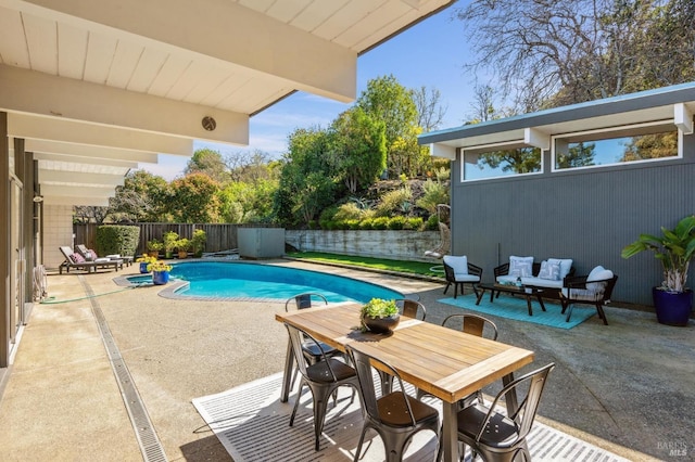 view of swimming pool featuring a fenced in pool, a patio area, outdoor lounge area, and a fenced backyard