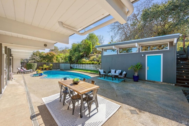 view of pool featuring a fenced in pool, a patio area, an outdoor structure, and a fenced backyard