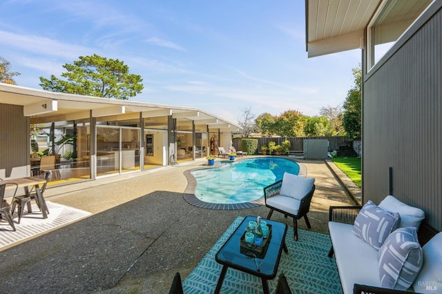 view of pool featuring a patio area, a fenced backyard, and a fenced in pool