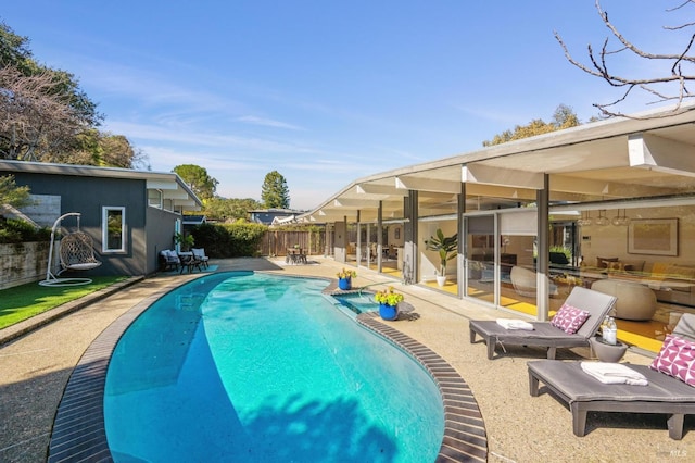 view of pool featuring a patio area, fence, and a fenced in pool