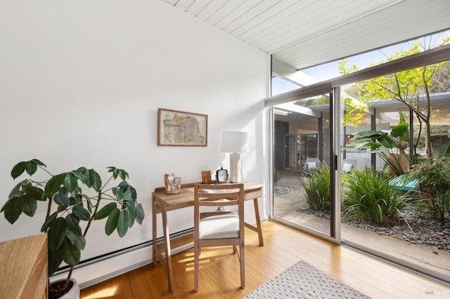 sunroom with a baseboard radiator