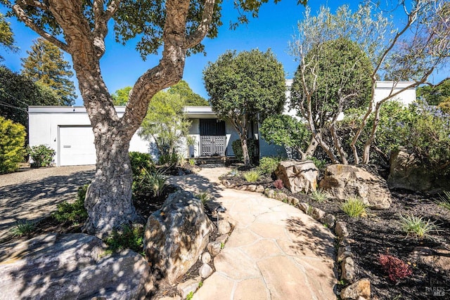 view of front facade featuring driveway and an attached garage