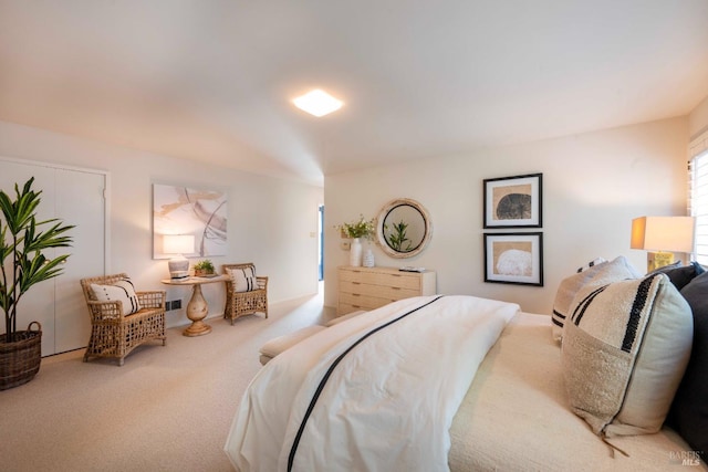 bedroom featuring light carpet and visible vents