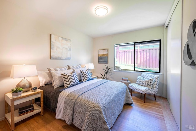 bedroom with wood finished floors