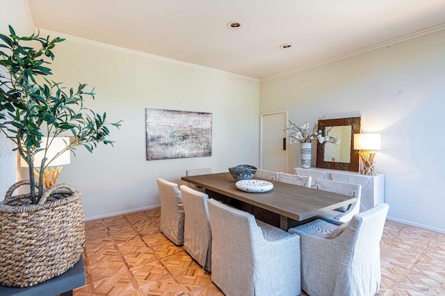 dining area with crown molding and baseboards