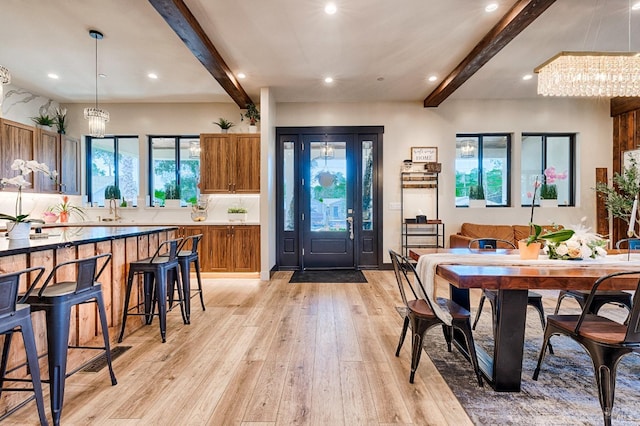 interior space featuring beamed ceiling, light wood-type flooring, and recessed lighting