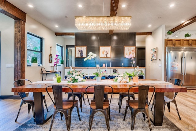 interior space with recessed lighting, light wood-type flooring, beam ceiling, and stainless steel built in fridge