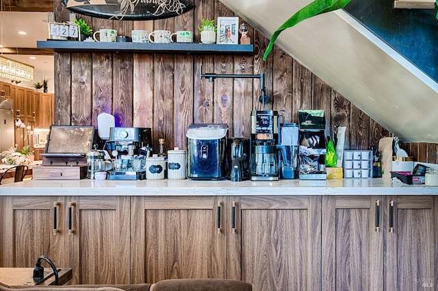 bar featuring wooden walls and vaulted ceiling